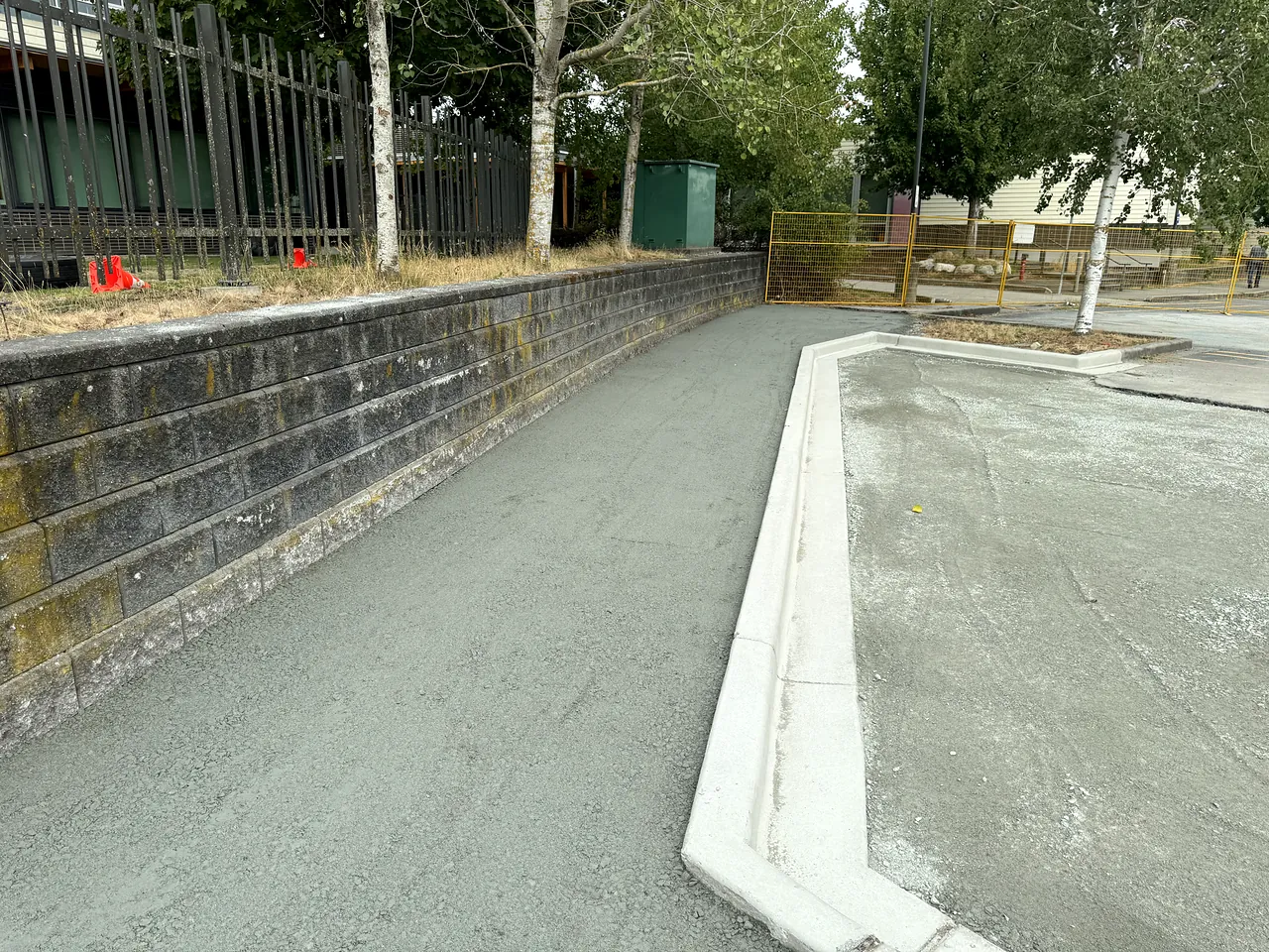 New concrete curb and gutter along the parking area