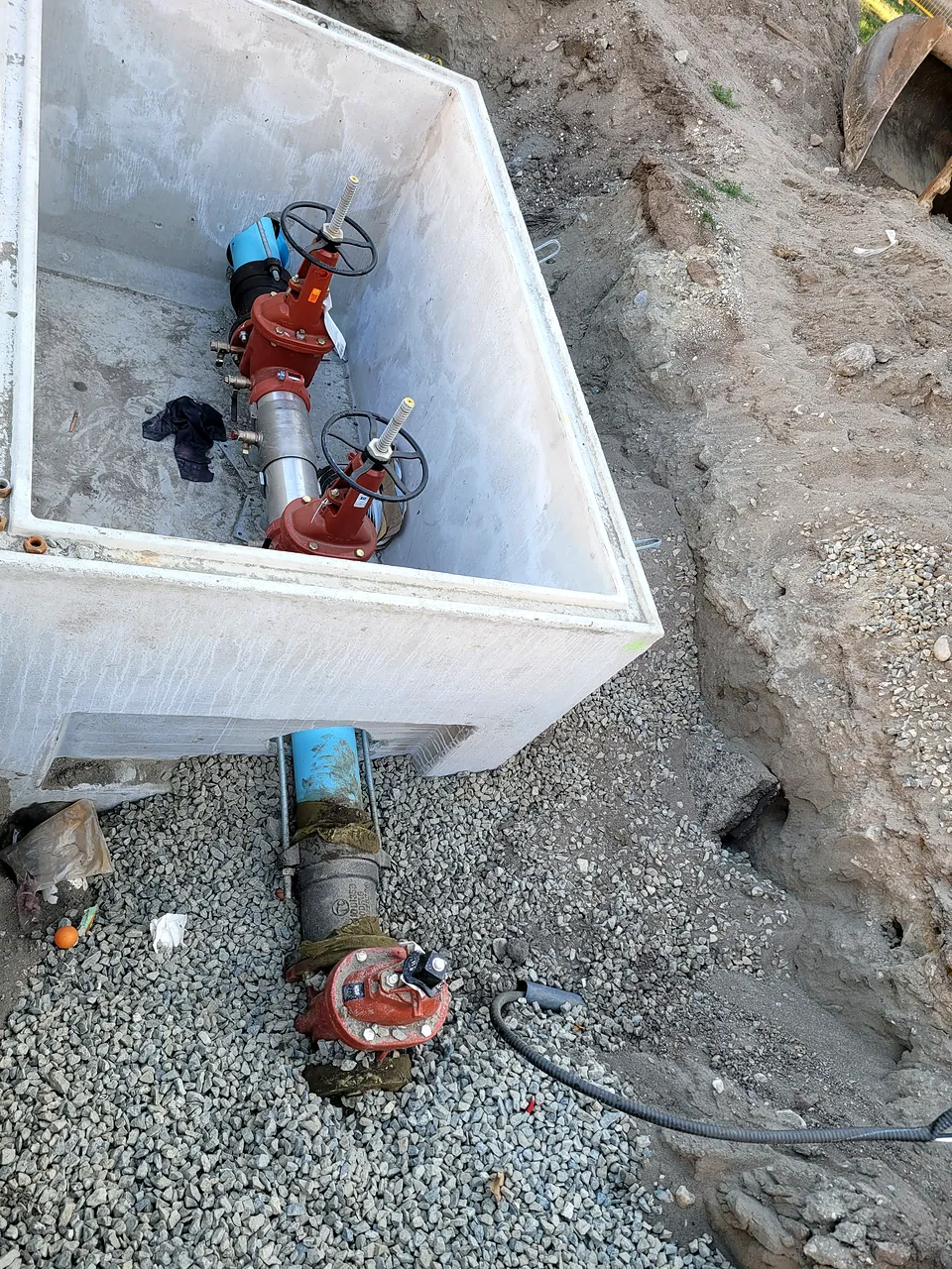 Double check valve assembly inside a precast chamber at Brighouse Elementary