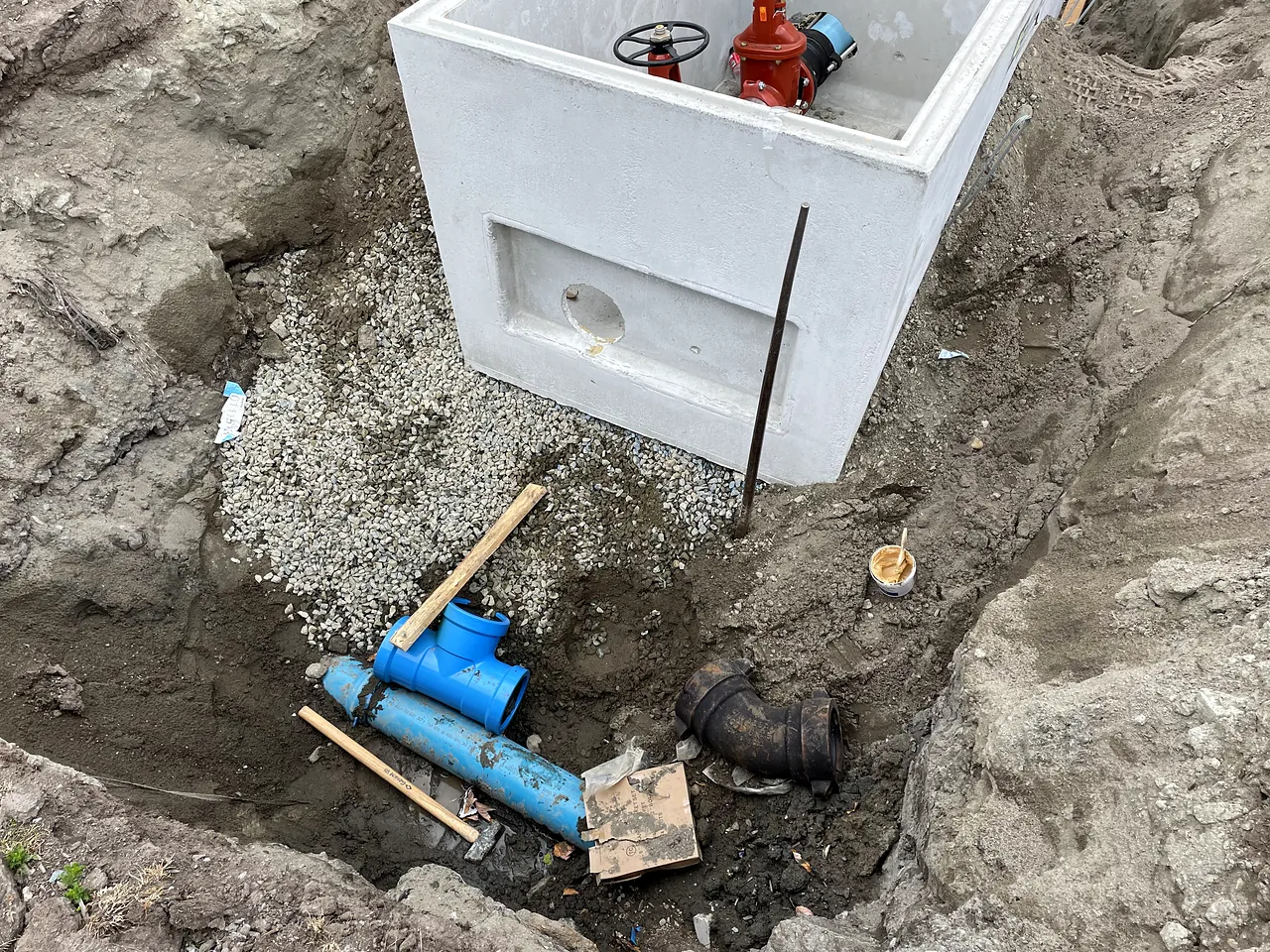 Ductile fittings and PVC water service below a precast chamber at Brighouse Elementary