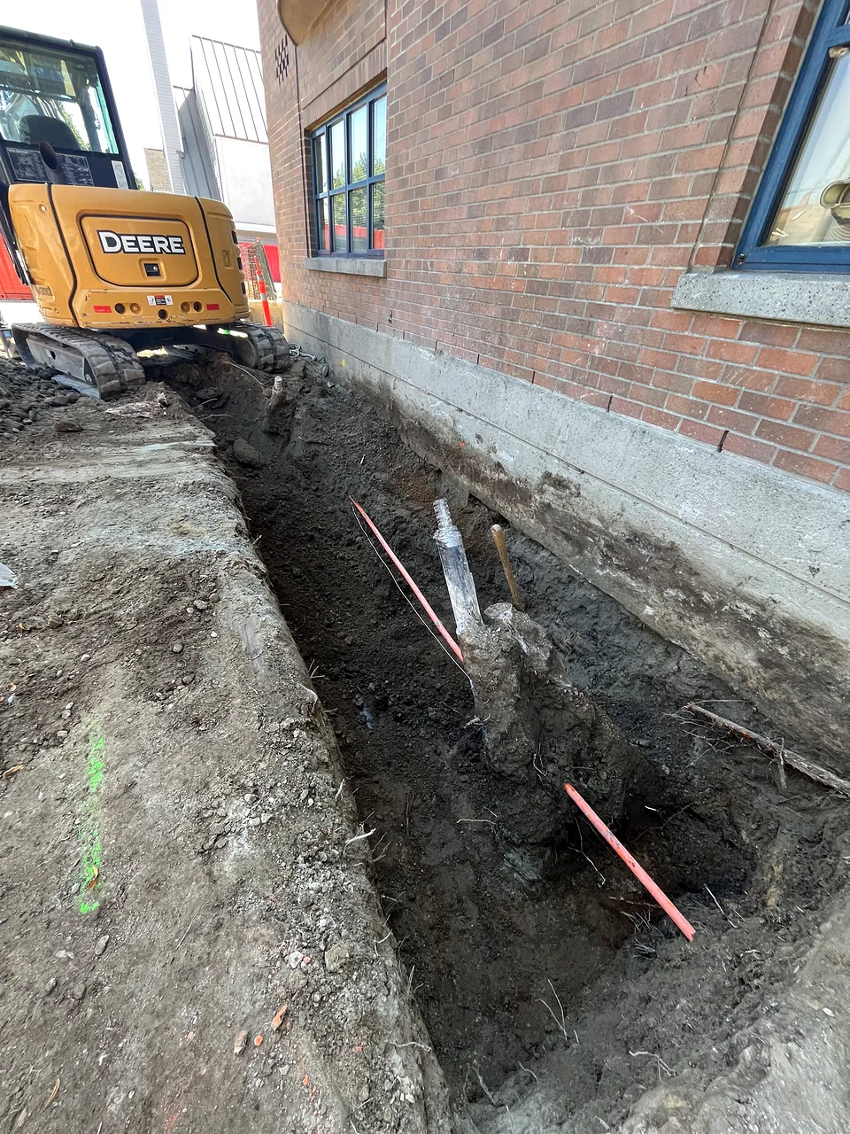 Perimeter trench along the brick fire hall wall
