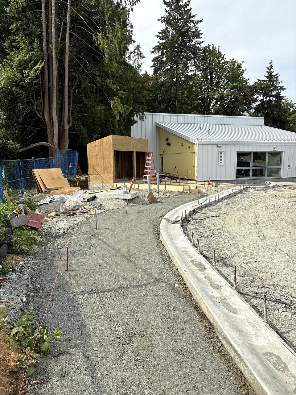 New curb and walkway subgrade beside the new building