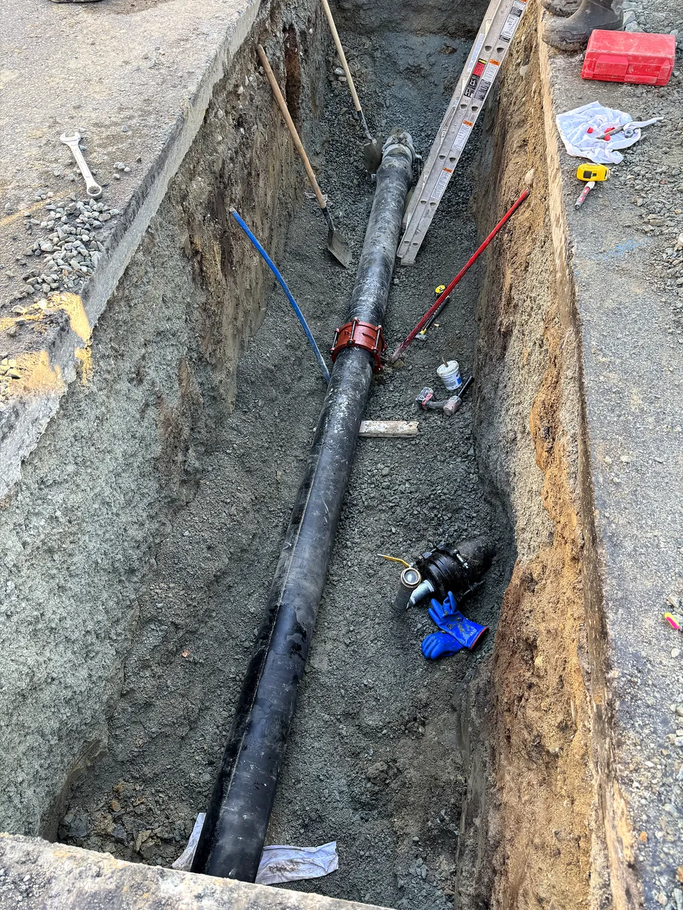Water main with valve installed in a trench