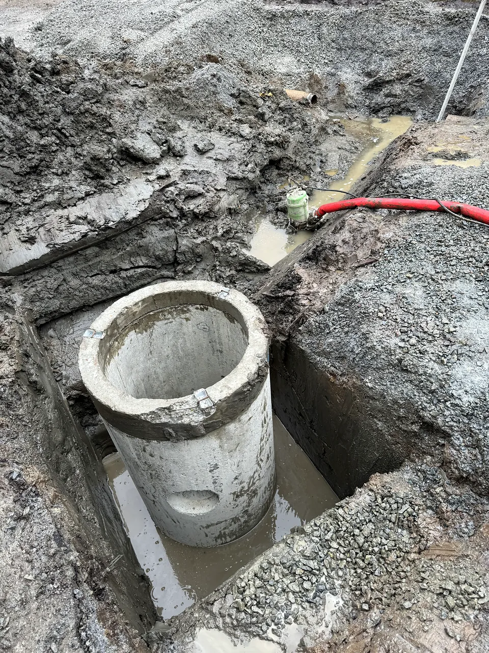 Precast catch basin barrel set in excavation at James Whiteside Elementary