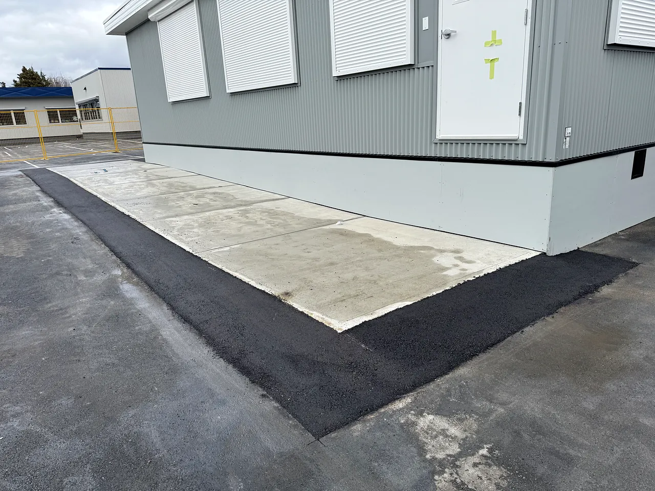 Finished concrete landing and restored edge at a portable, James Whiteside Elementary