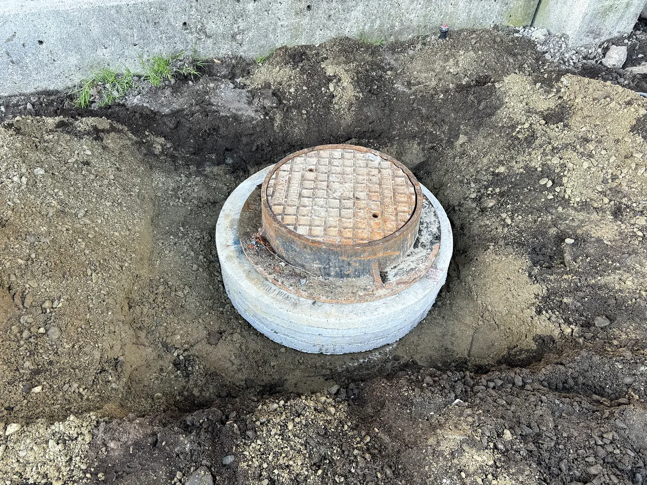 New manhole frame set on its riser