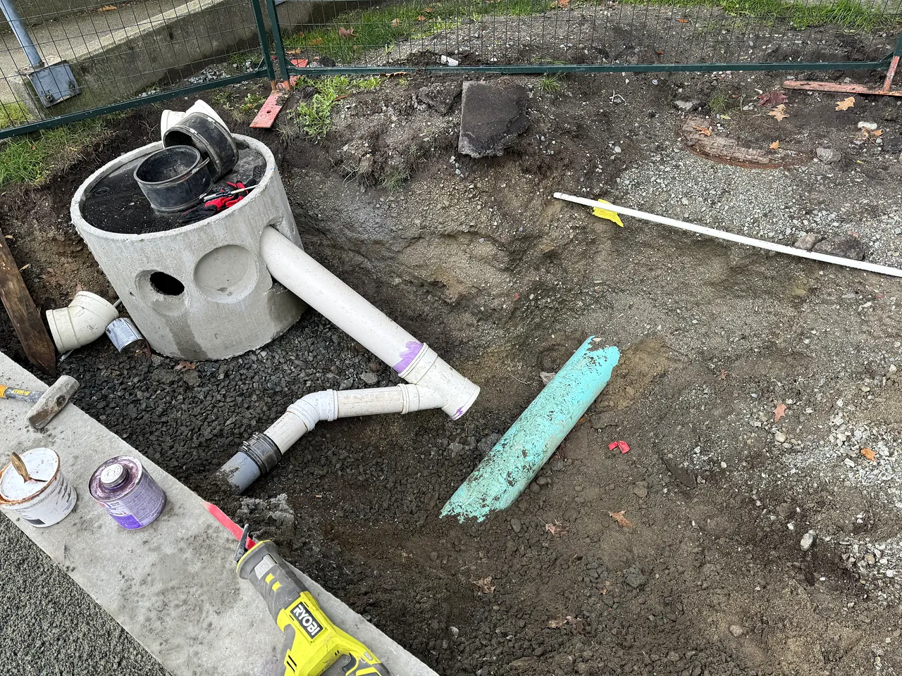 Sump and PVC sanitary fittings being installed
