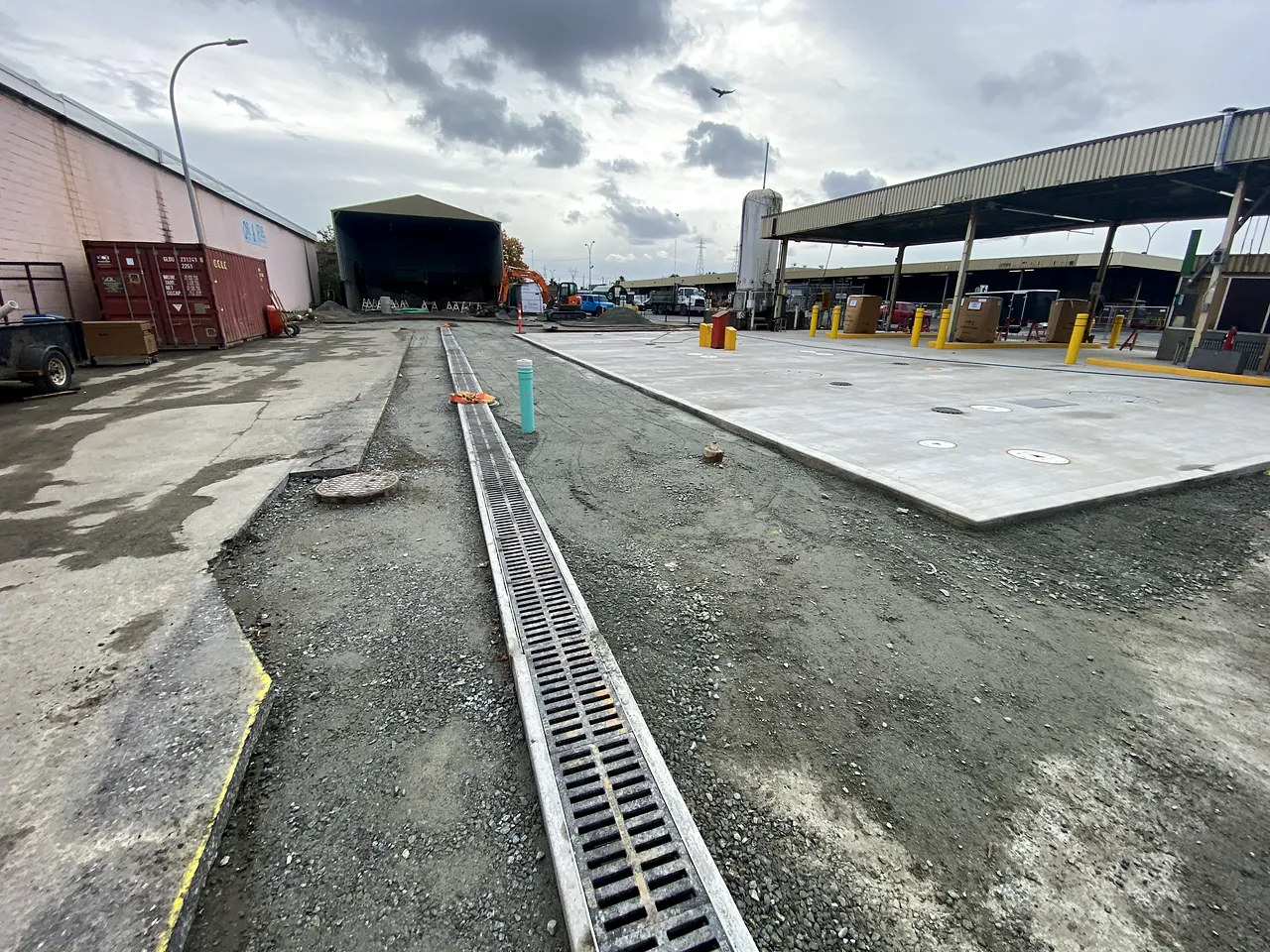 New trench drain and concrete pad at the fuel station