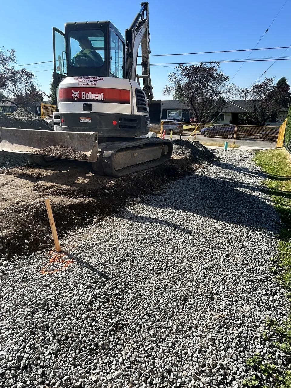 Excavator on prepared gravel subgrade