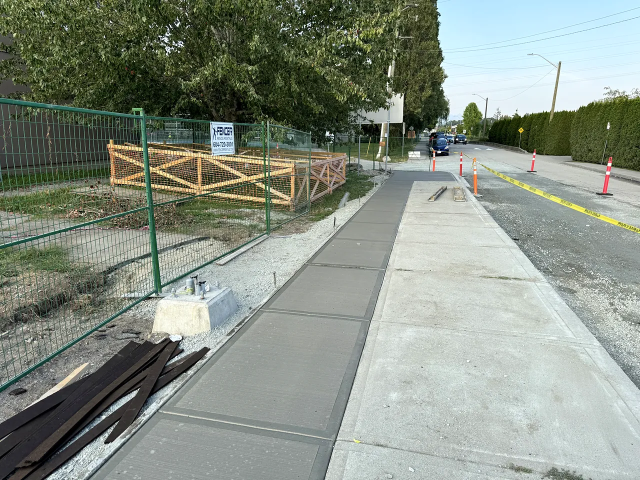 New concrete sidewalk along the road frontage