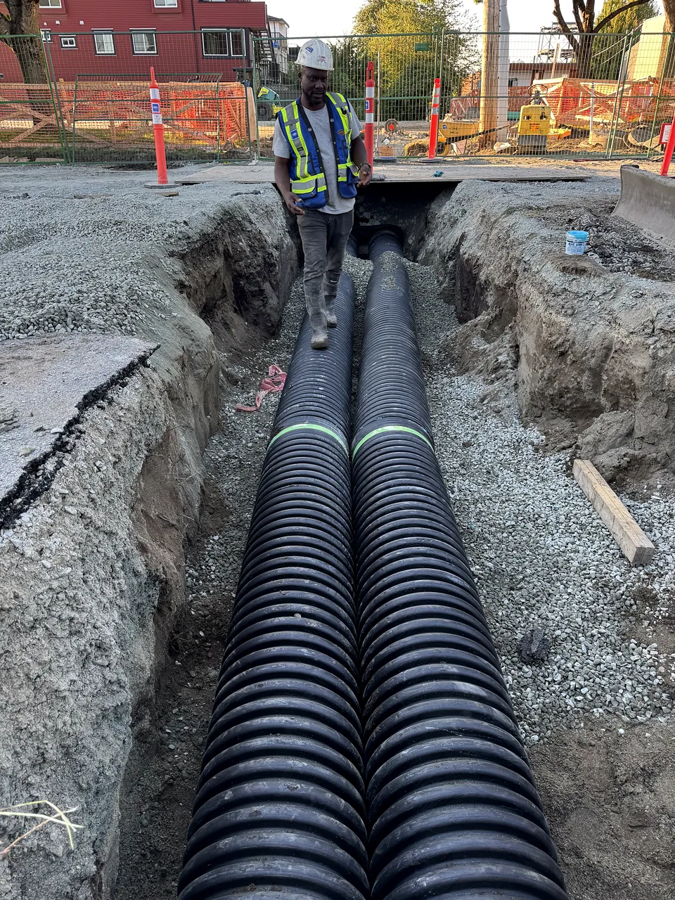 Twin corrugated storm pipes installed in the trench