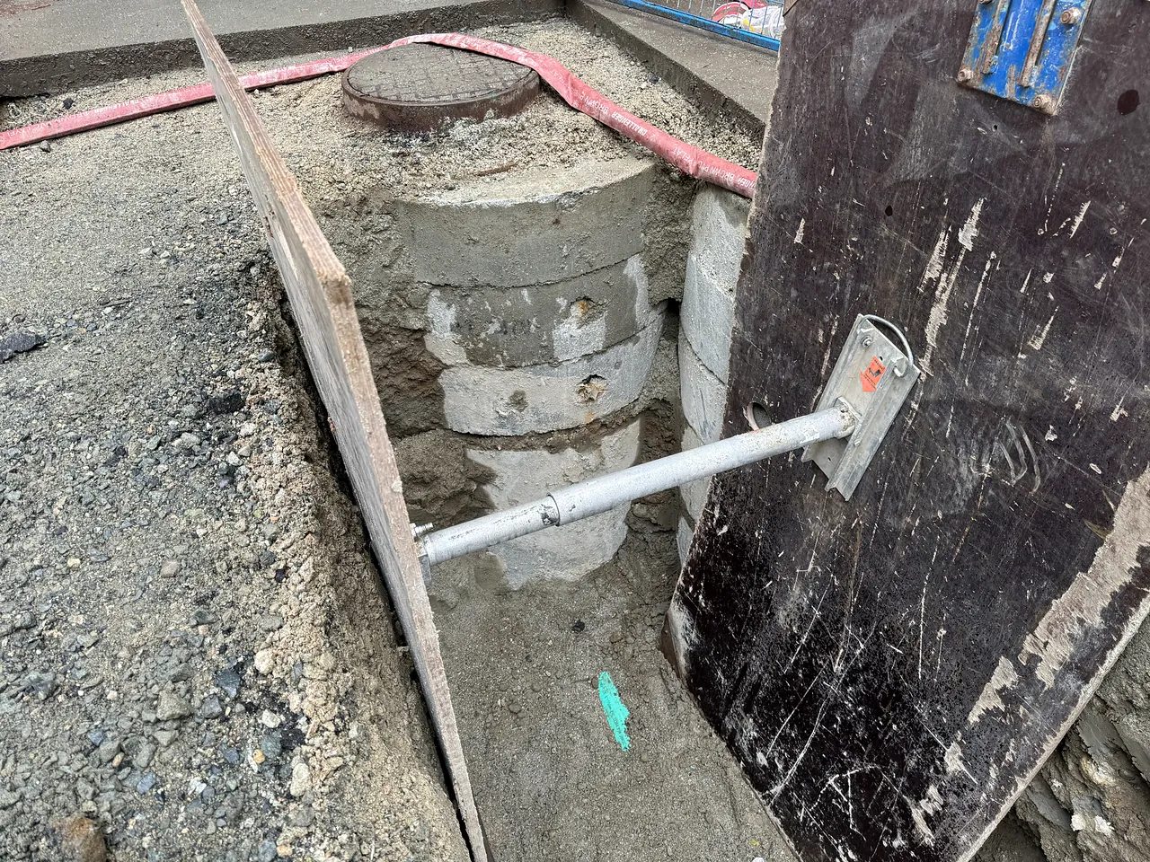 Manhole riser sections installed in the excavation