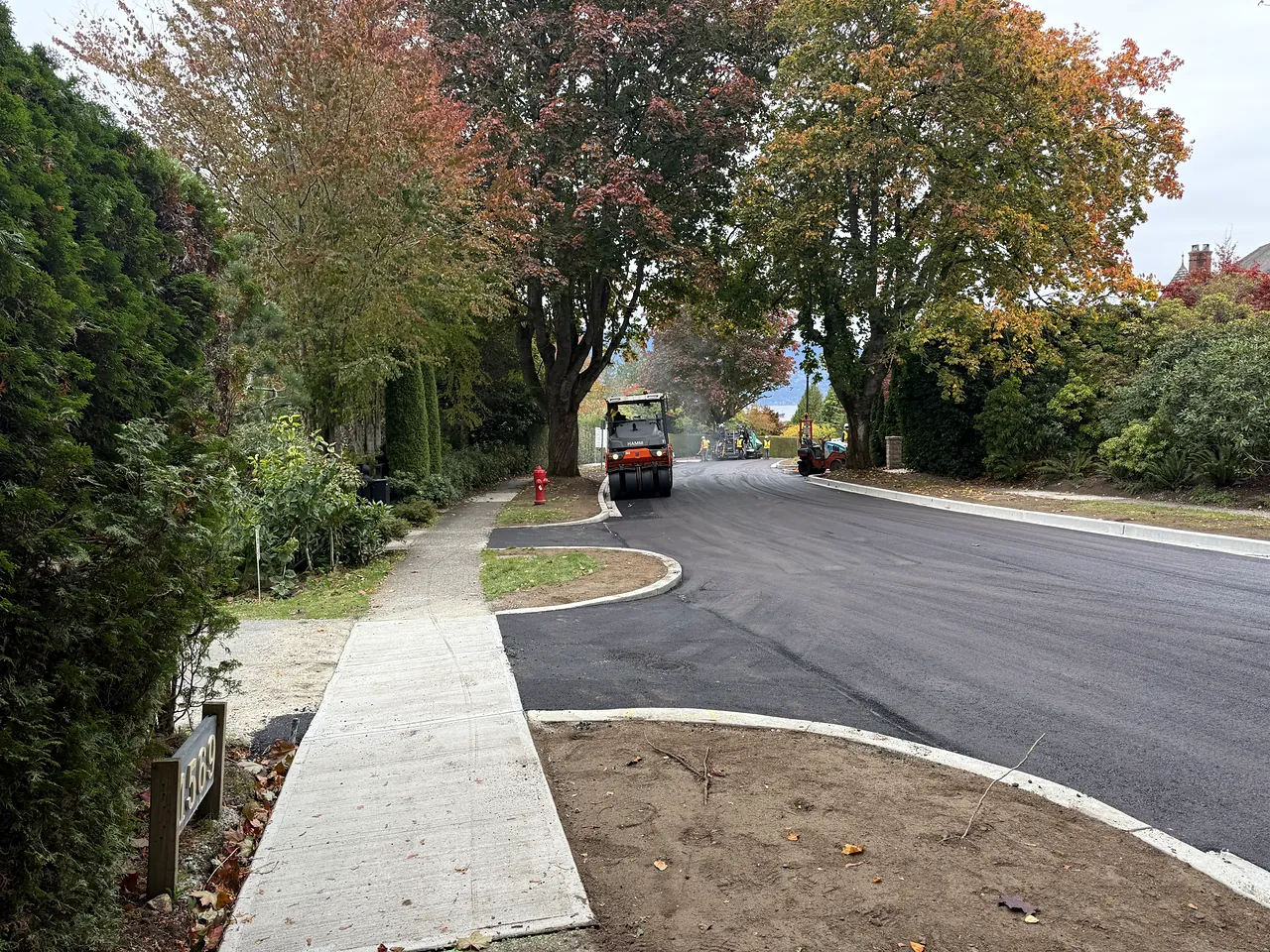 New sidewalk, curb and restored road after sewer separation